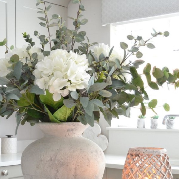 Learn how to arrange flowers in a vase 